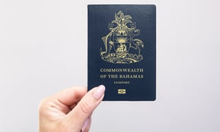 Hand holding a Bahamas passport