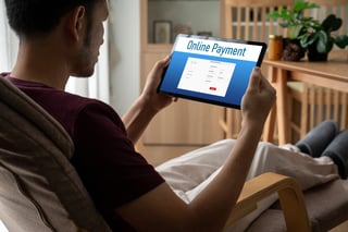 Man holding a tablet for online payment