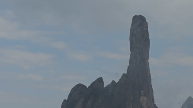Tall finger-shaped rocky pinnacle