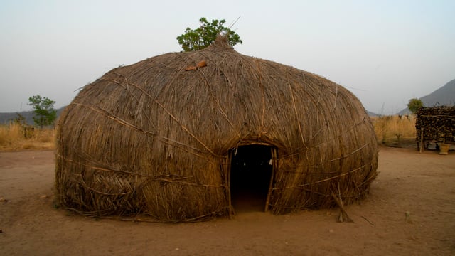 Traditional Grass Hut In A Rural Cameroon Village
